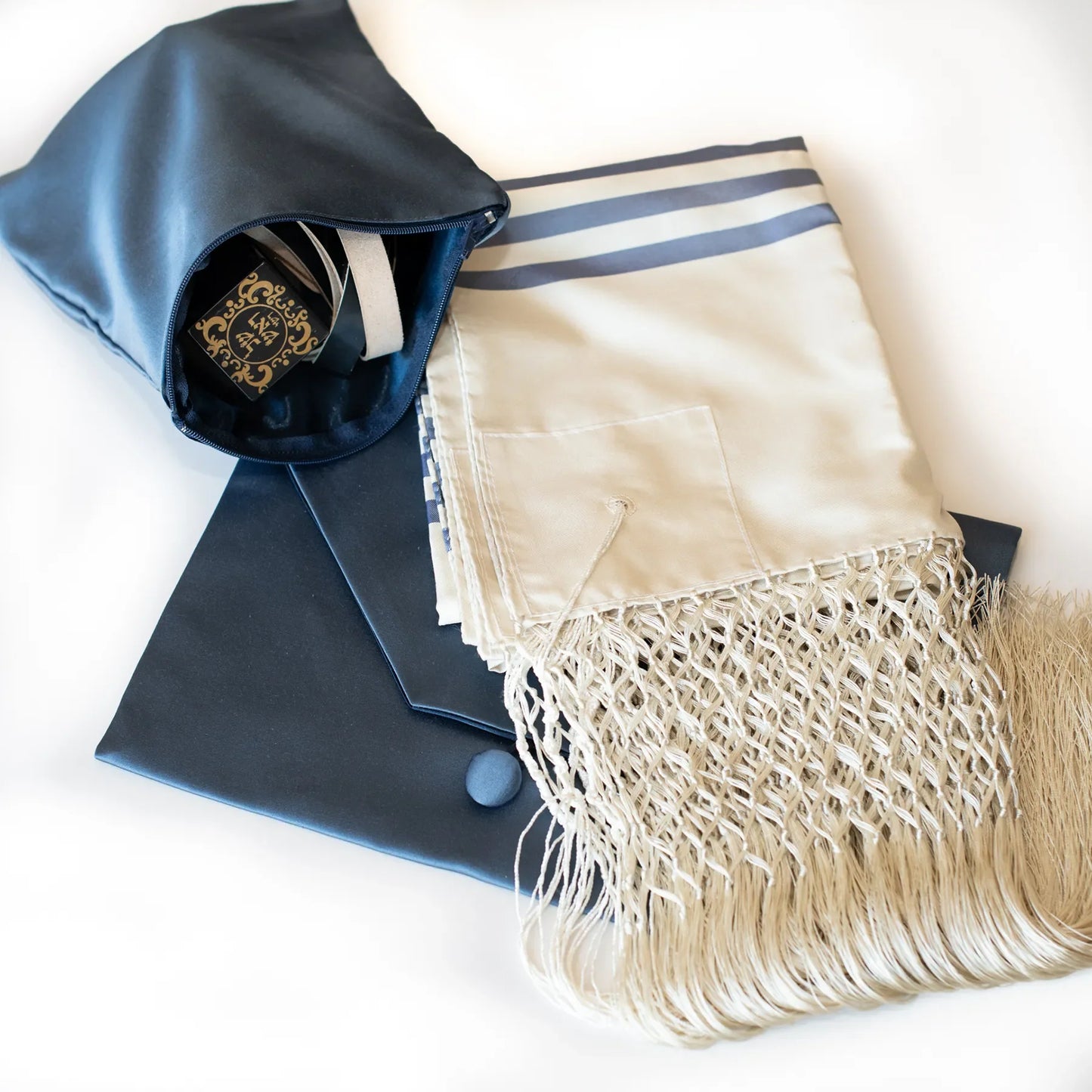 Tefillin bag next to tallit