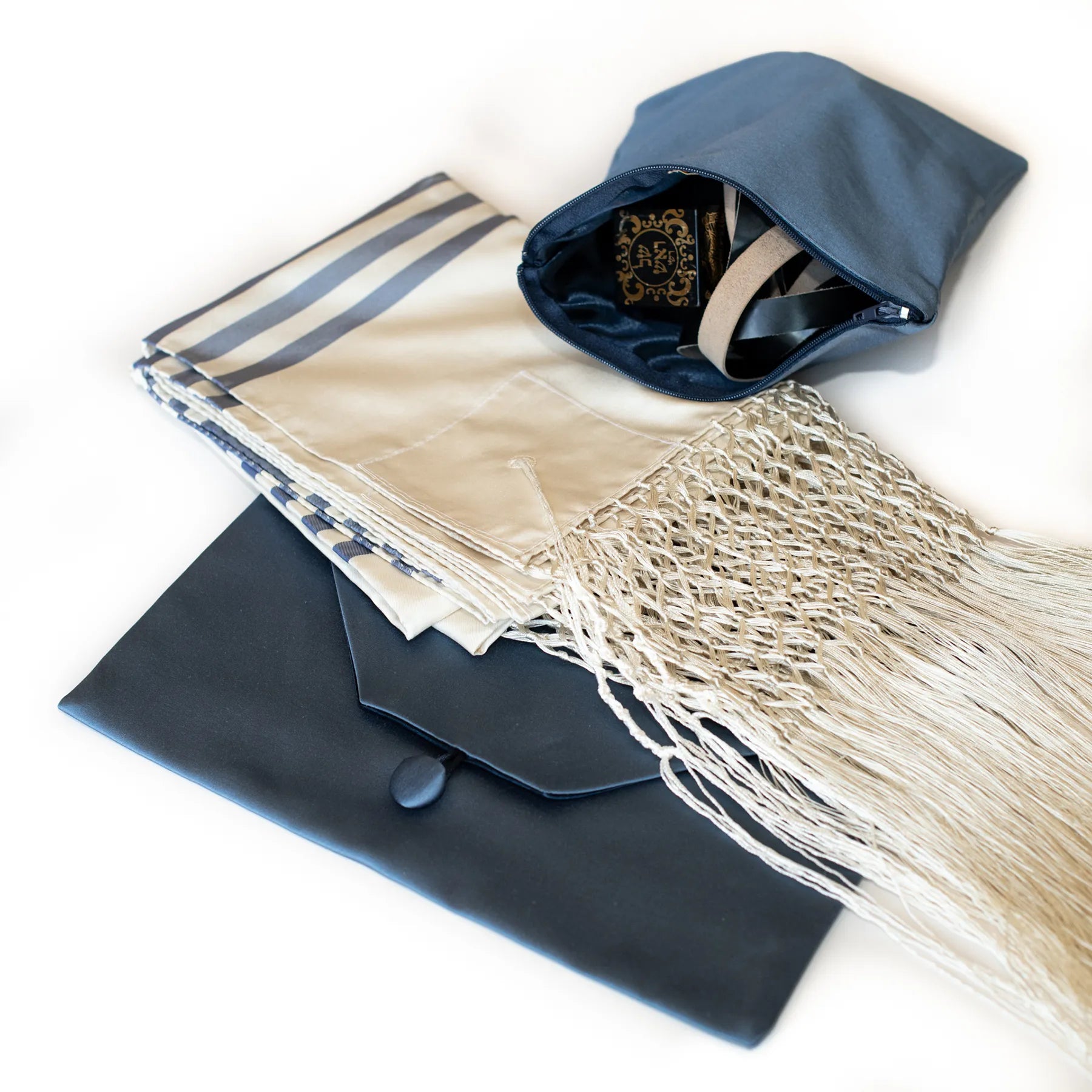 folded tallit and Tefillin bag